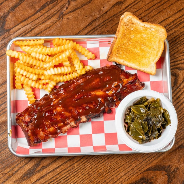Woody's Signature Baby Back Ribs.
